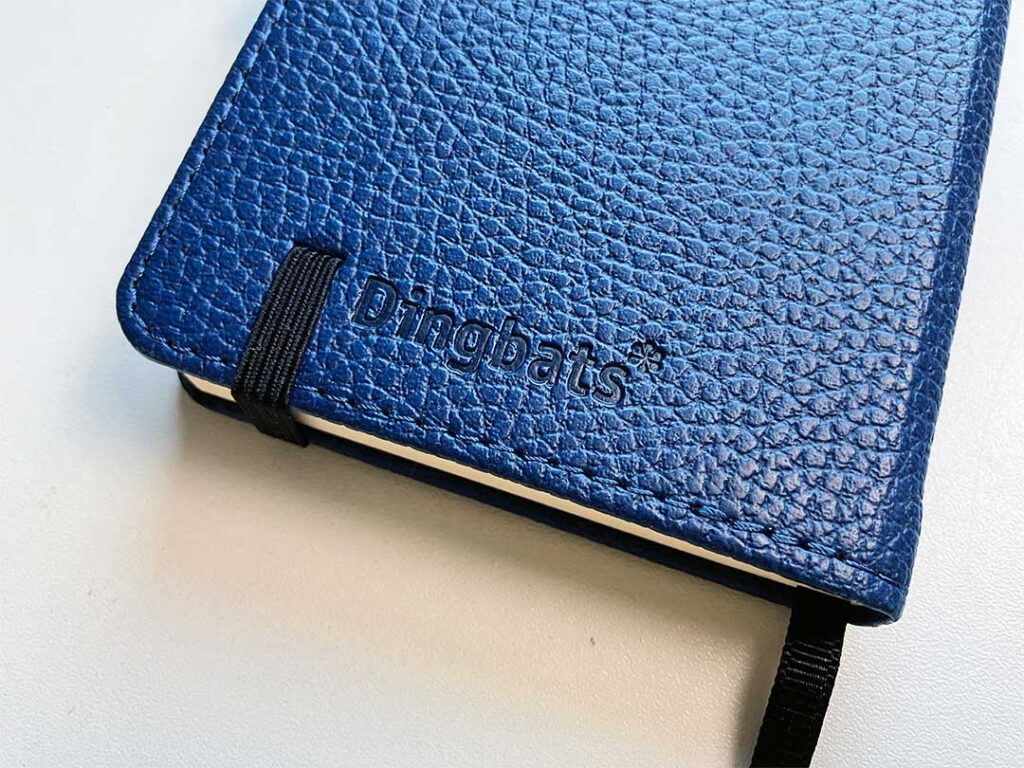 Dingbats* notitieboek logo op achterkant